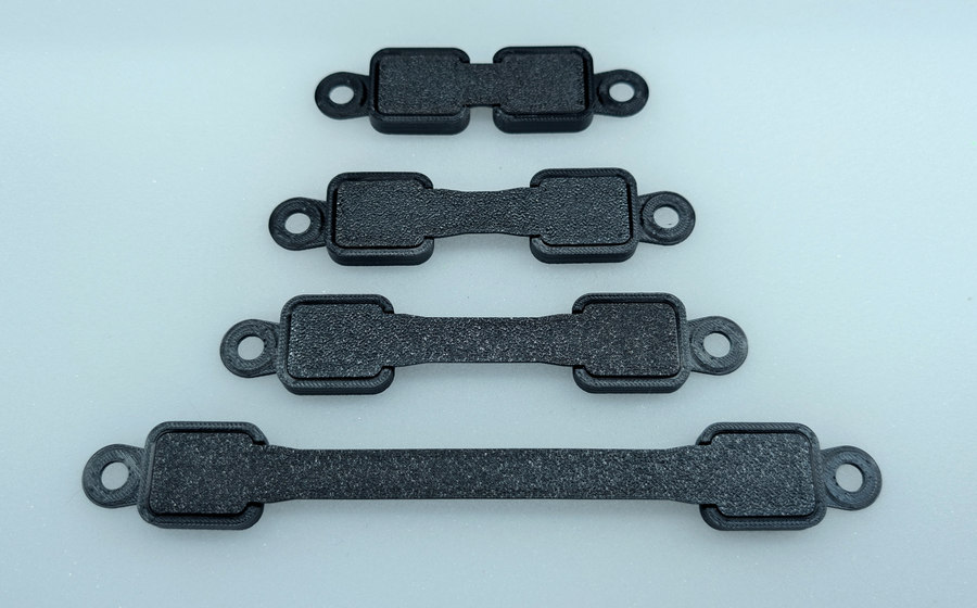 Four assembled Standard bridges on a pale background.